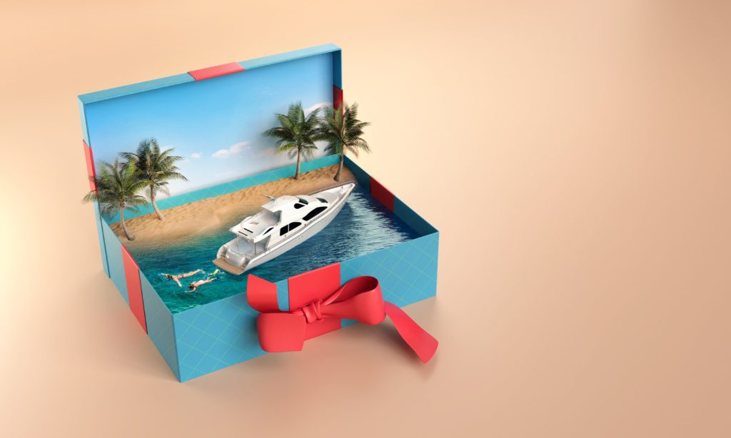 Boite cadeau avec à l'intérieur un bateau et une ile